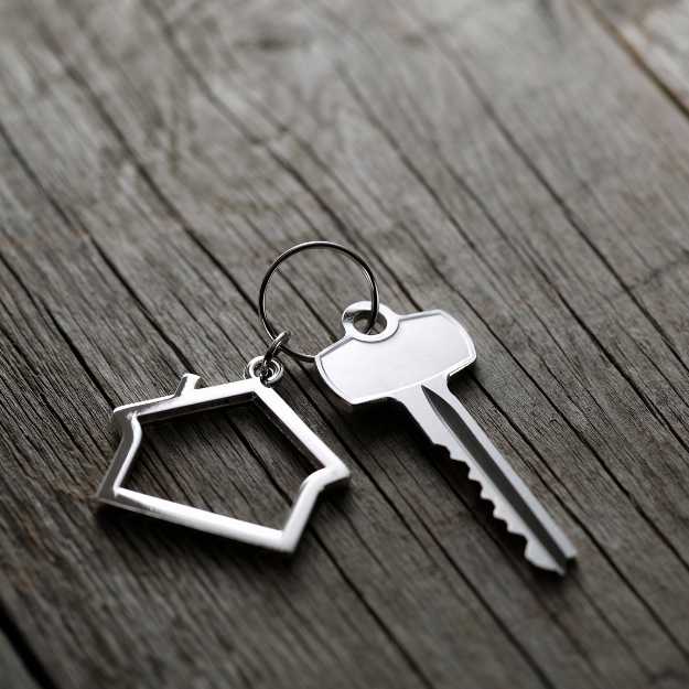 Buy a Home Button - Stock Image of Home Keychain and key - with Sara Schrader NYS Licensed Real Estate Salesperson at Warren Real Estate